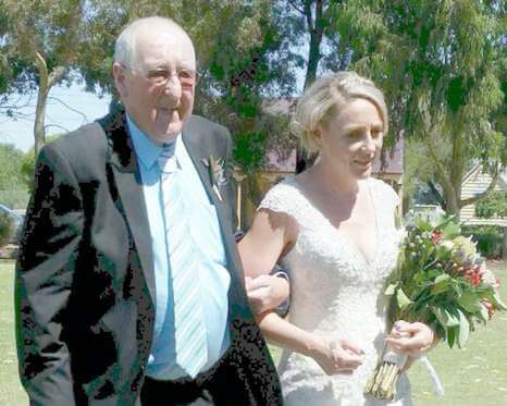 Sick dad walks daughter down the aisle after she received a generous wedding dress gift