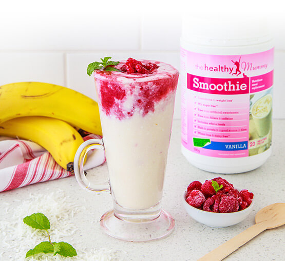 Smoothie in glass cup with raspberries