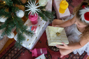 girl sitting with present in her hands